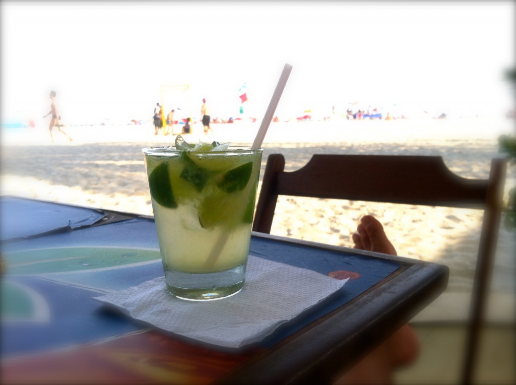 Enjoying a caipirinha at Ipanema beach