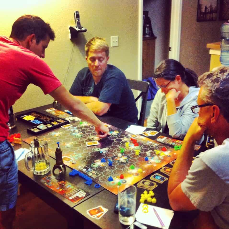 Playing our favorite board game (Settlers of Catan) with the family